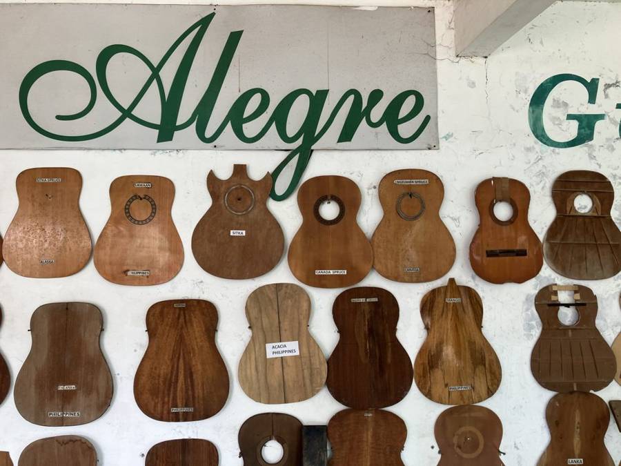 Guitar bodies on the wall at Alegre Guitars