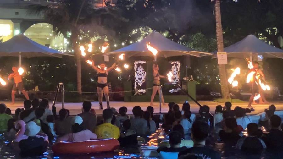 Fire dance show by the hotel pool